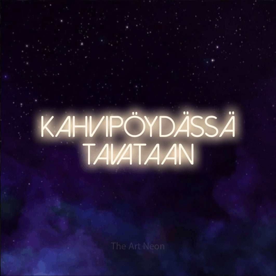 LED neon sign reading “Kahvipöydässä tavataan”, arranged in 2 lines.