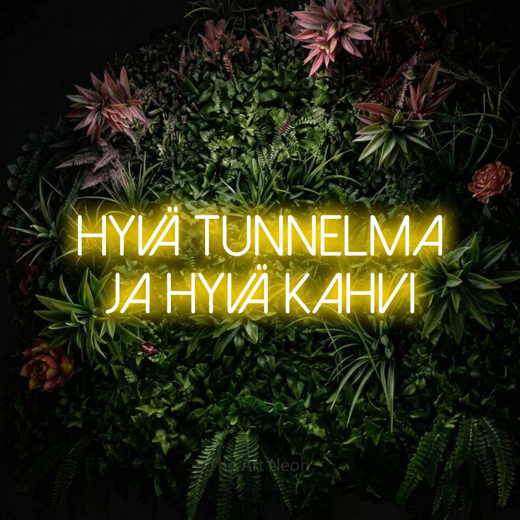 LED neon sign reading “hyvä tunnelma ja hyvä kahvi”, arranged in 2 lines.
