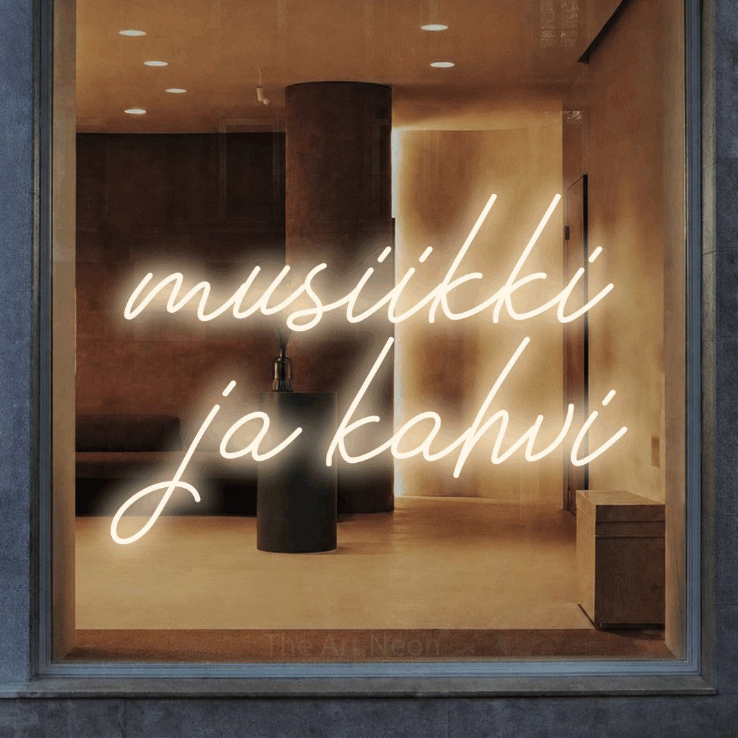 LED neon sign reading “musiikki ja kahvi”, arranged in 2 lines.