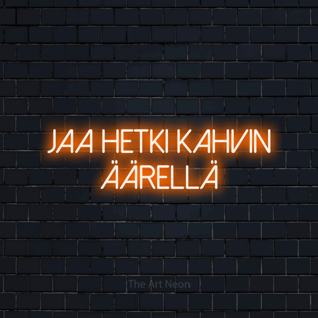 LED neon sign reading “jaa hetki kahvin äärellä”, arranged in 2 lines.