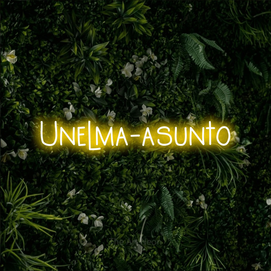LED neon sign reading “Unelma-asunto”, arranged in a single line.