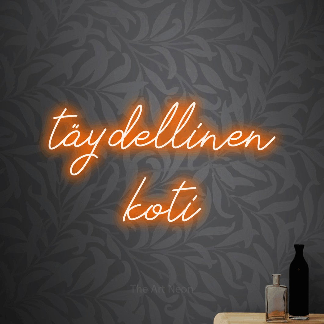 LED neon sign reading “täydellinen koti”, arranged in 2 lines.