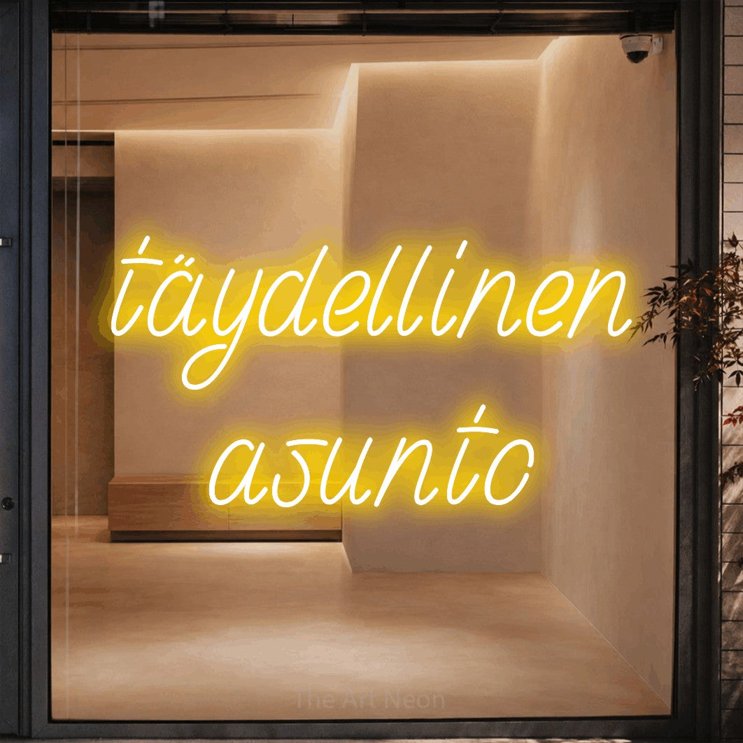 LED neon sign reading “täydellinen asunto”, arranged in 2 lines.