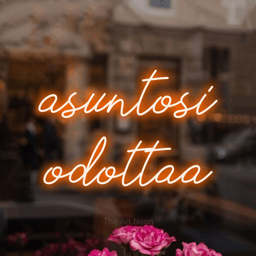 LED neon sign reading “asuntosi odottaa”, arranged in 2 lines.