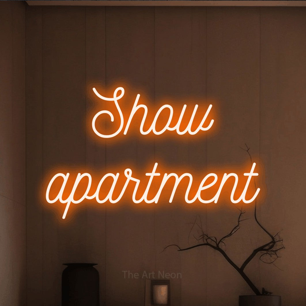 LED neon sign reading “Show apartment”, arranged in 2 lines.