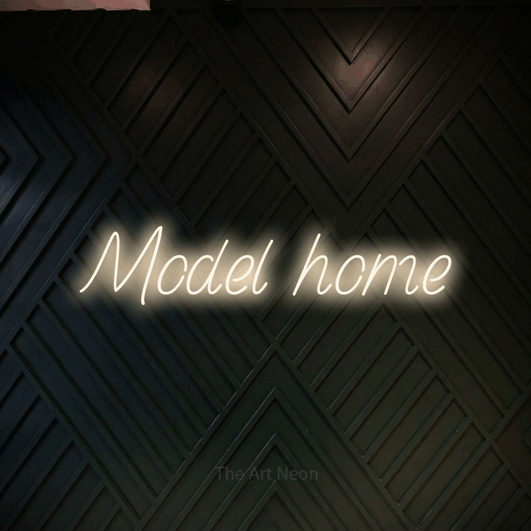 LED neon sign reading “Model home”, arranged in a single line.