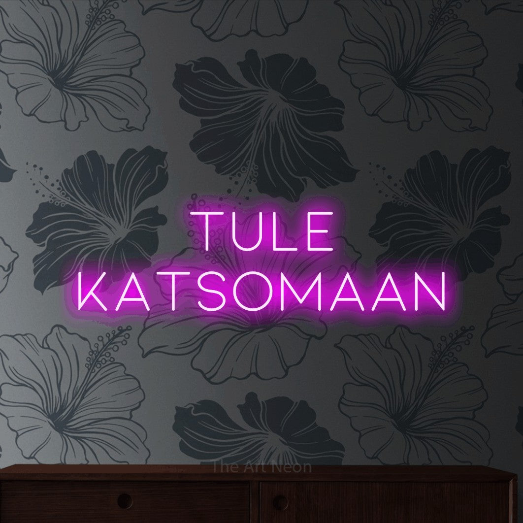 LED neon sign reading “Tule katsomaan”, arranged in 2 lines.