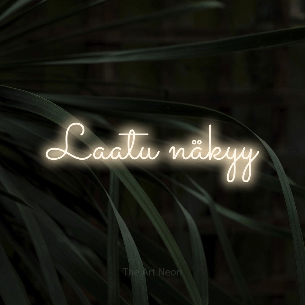 LED neon sign reading “Laatu näkyy”, arranged in a single line.