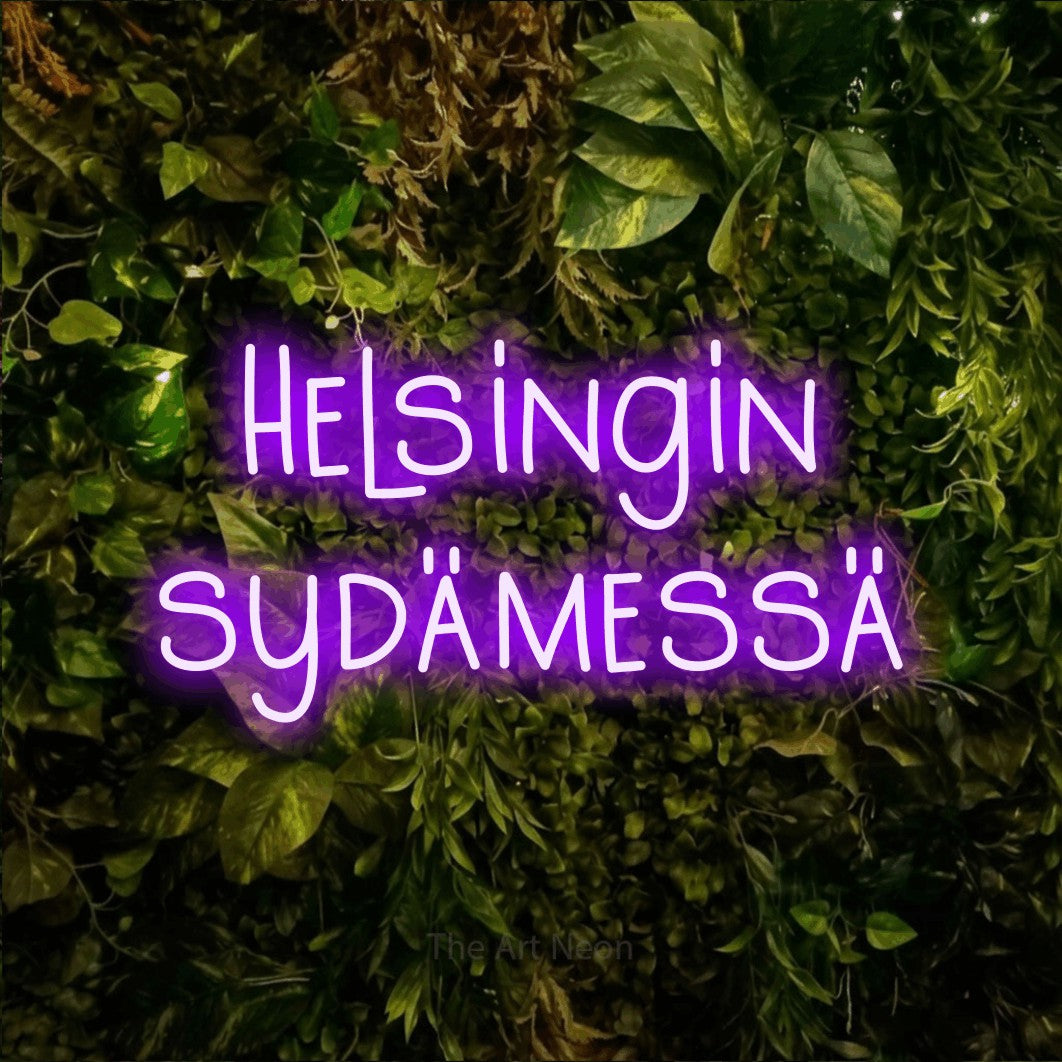 LED neon sign reading “Helsingin sydämessä”, arranged in 2 lines.