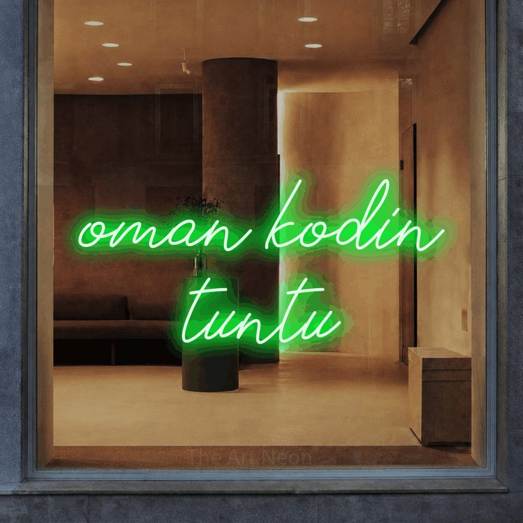 LED neon sign reading “oman kodin tuntu”, arranged in 2 lines.