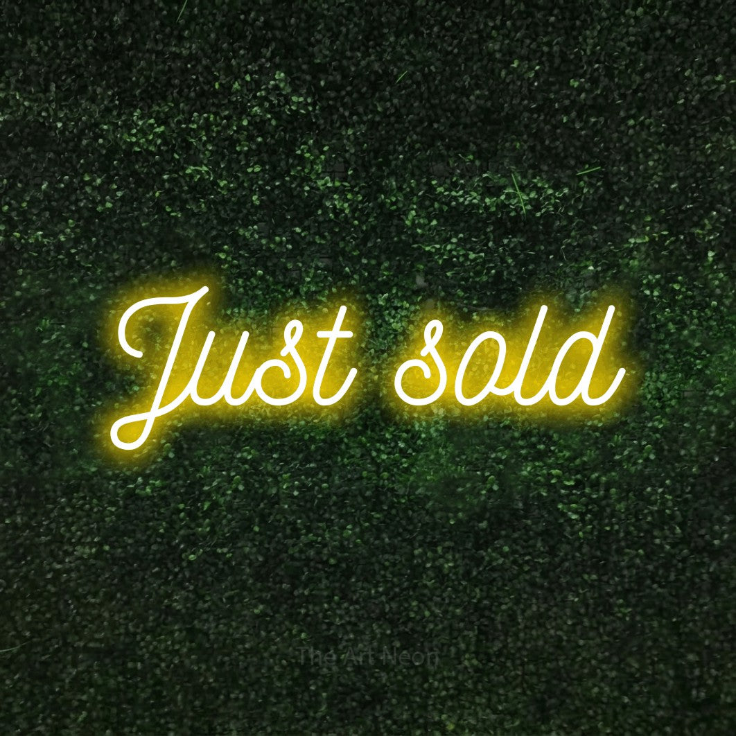 LED neon sign reading “Just sold”, arranged in a single line.
