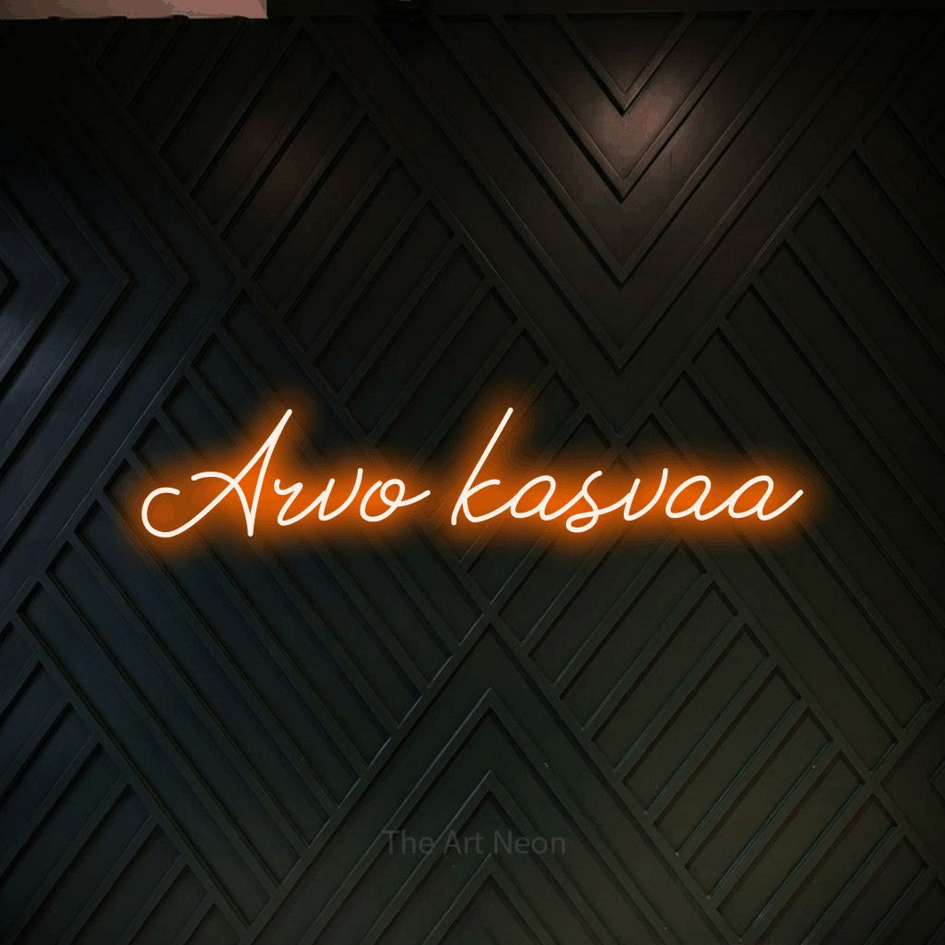 LED neon sign reading “Arvo kasvaa”, arranged in a single line.