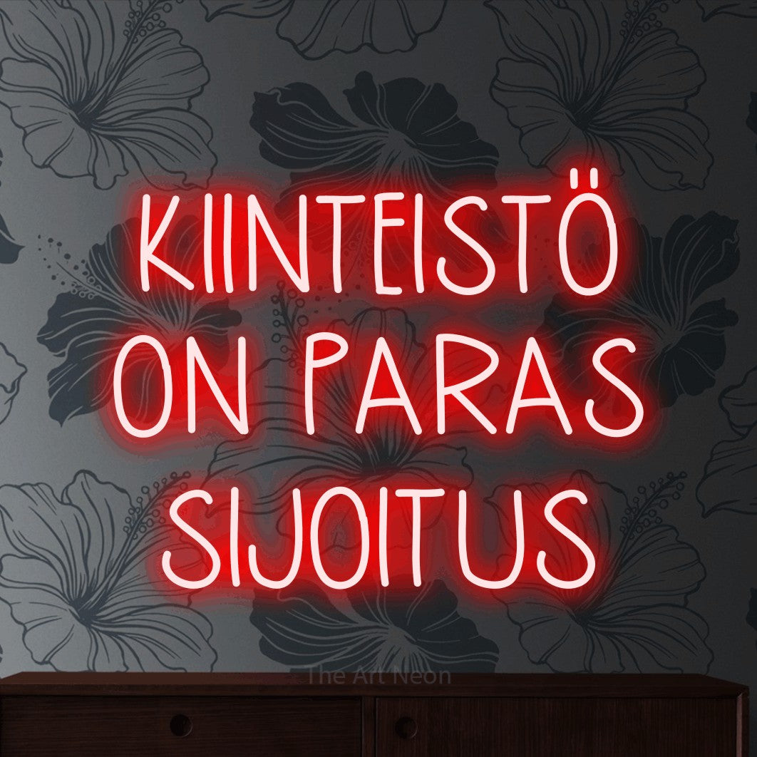 LED neon sign reading “KIINTEISTÖ ON PARAS SIJOITUS”, arranged in 3 lines.