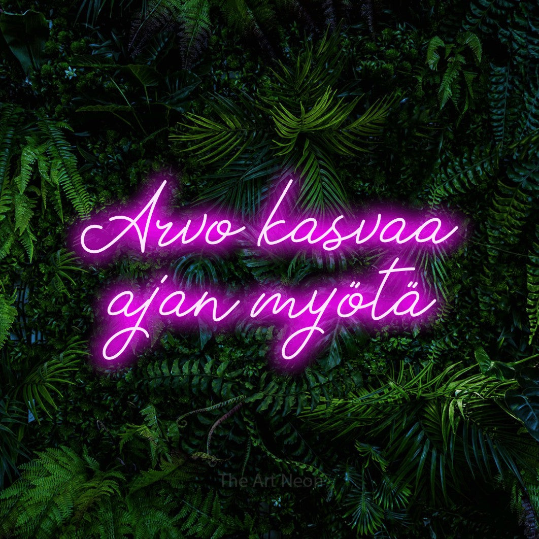 LED neon sign reading “Arvo kasvaa ajan myötä”, arranged in 2 lines.