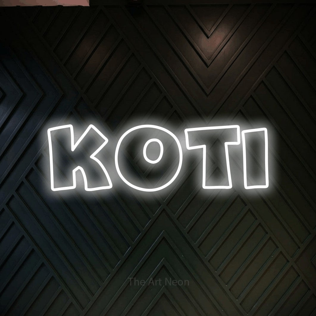 LED neon sign reading “Koti”, arranged in a single line.