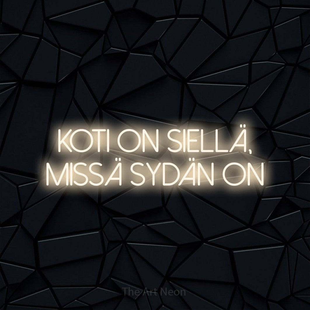 LED neon sign reading “koti on siellä, missä sydän on”, arranged in 2 lines.