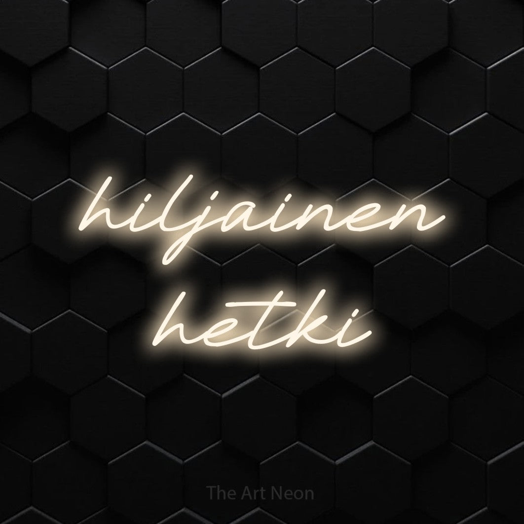 LED neon sign reading “hiljainen hetki”, arranged in 2 lines.