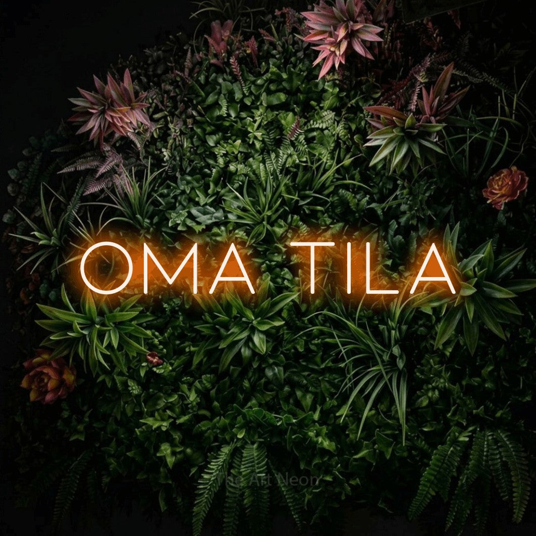 LED neon sign reading “Oma tila”, arranged in a single line.
