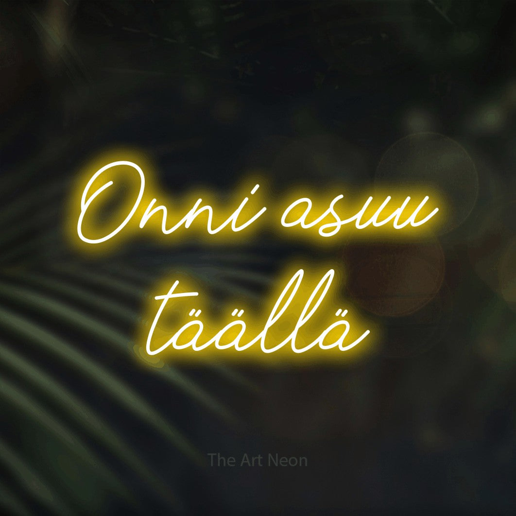 LED neon sign reading “Onni asuu täällä”, arranged in 2 lines.