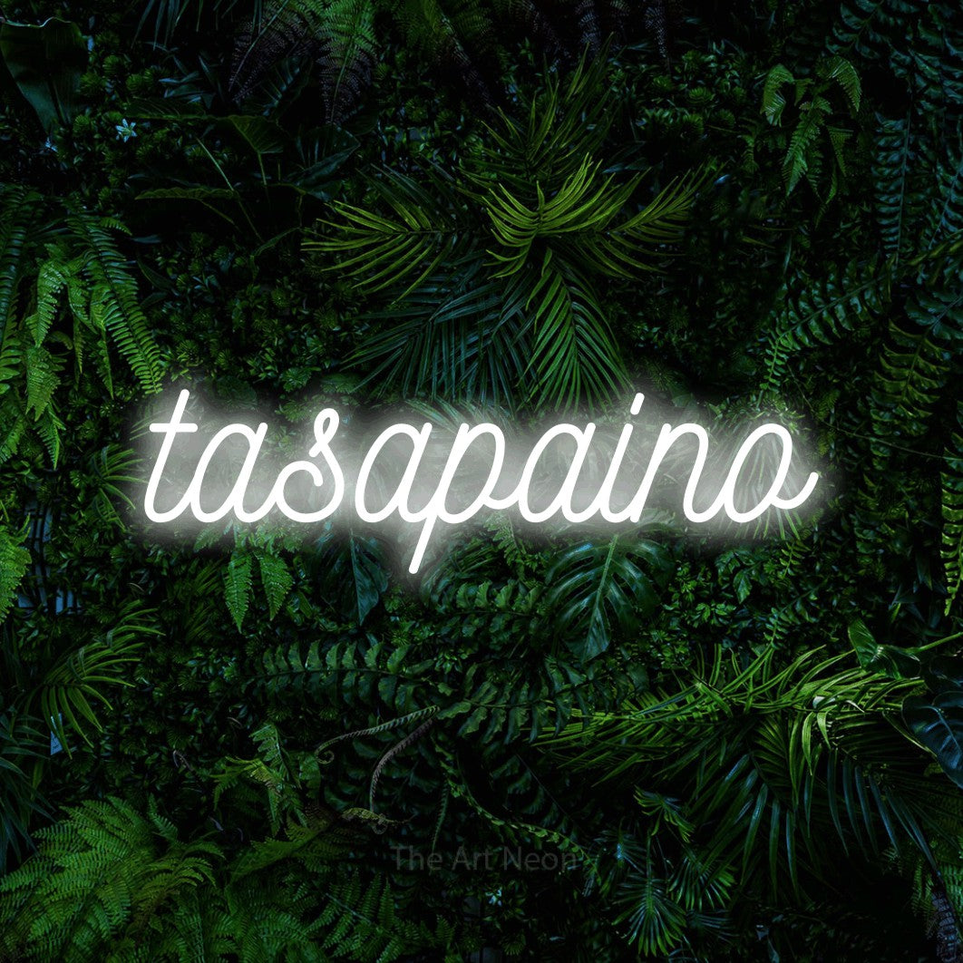 LED neon sign reading “tasapaino”, arranged in a single line.