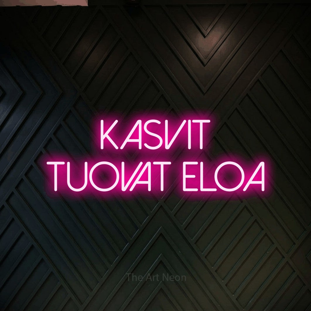 LED neon sign reading “Kasvit tuovat eloa”, arranged in 2 lines.