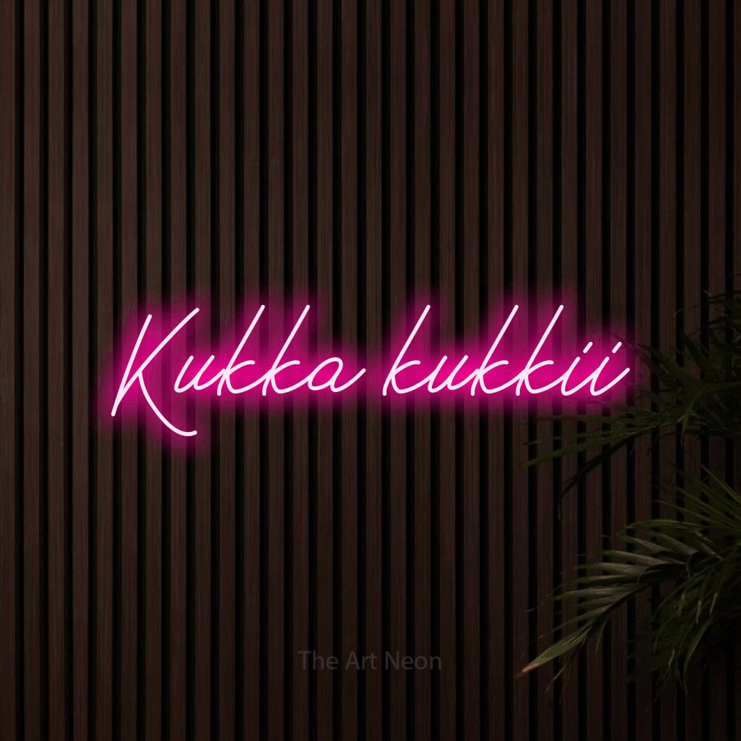 LED neon sign reading “Kukka kukkii”, arranged in a single line.