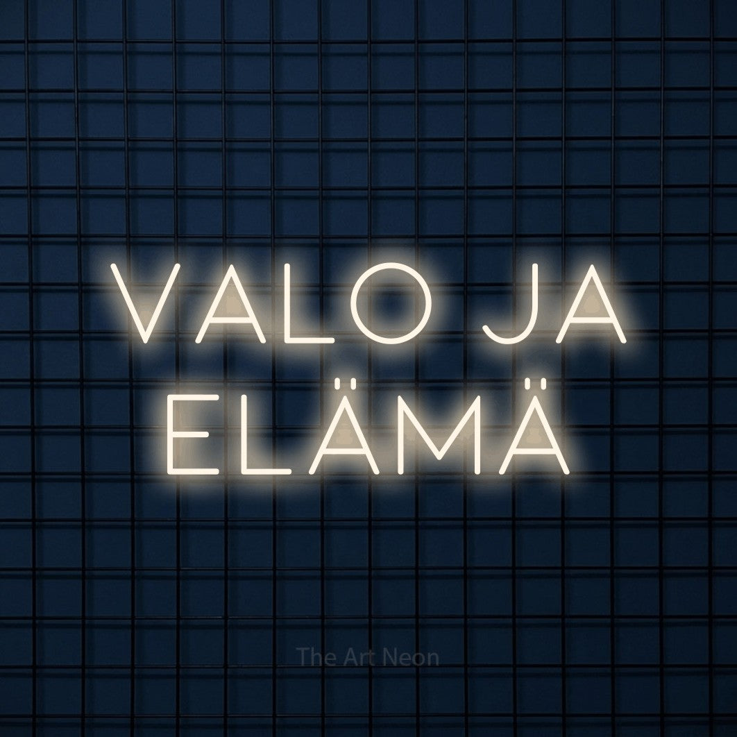 LED neon sign reading “valo ja elämä”, arranged in 2 lines.