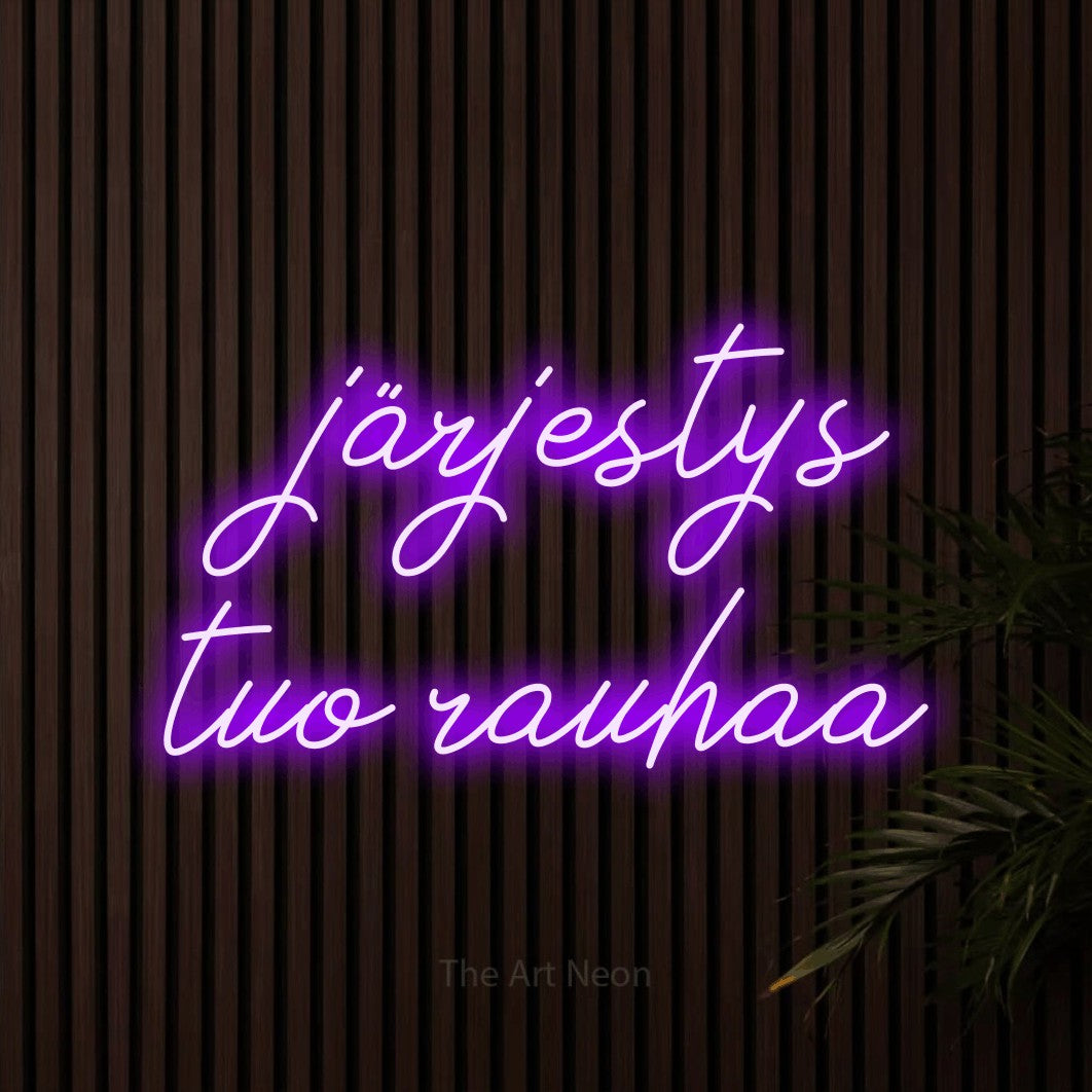 LED neon sign reading “järjestys tuo rauhaa”, arranged in 2 lines.