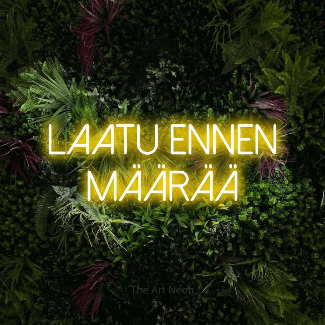LED neon sign reading “Laatu ennen määrää”, arranged in 2 lines.