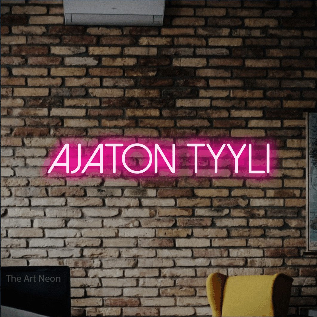 LED neon sign reading “Ajaton tyyli”, arranged in a single line.