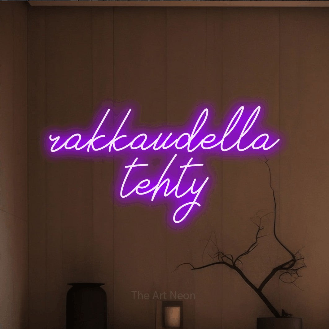 LED neon sign reading “rakkaudella tehty”, arranged in 2 lines.
