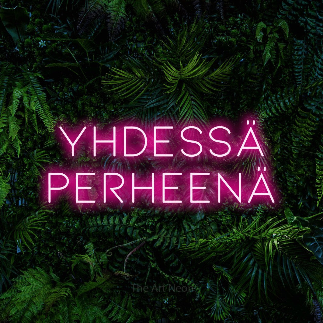 LED neon sign reading “YHDESSÄ PERHEENÄ”, arranged in 2 lines.