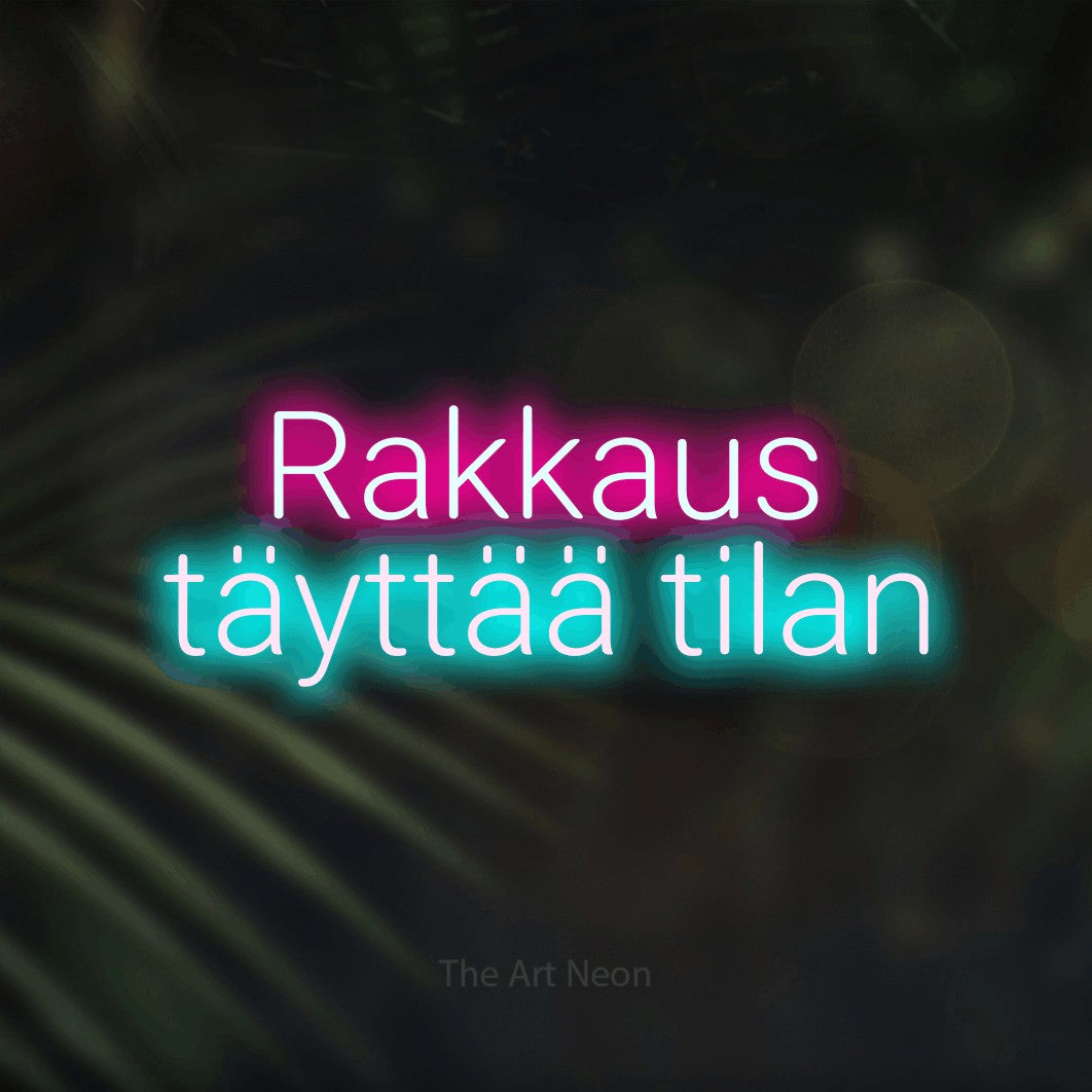 LED neon sign reading “Rakkaus täyttää tilan”, arranged in 2 lines.