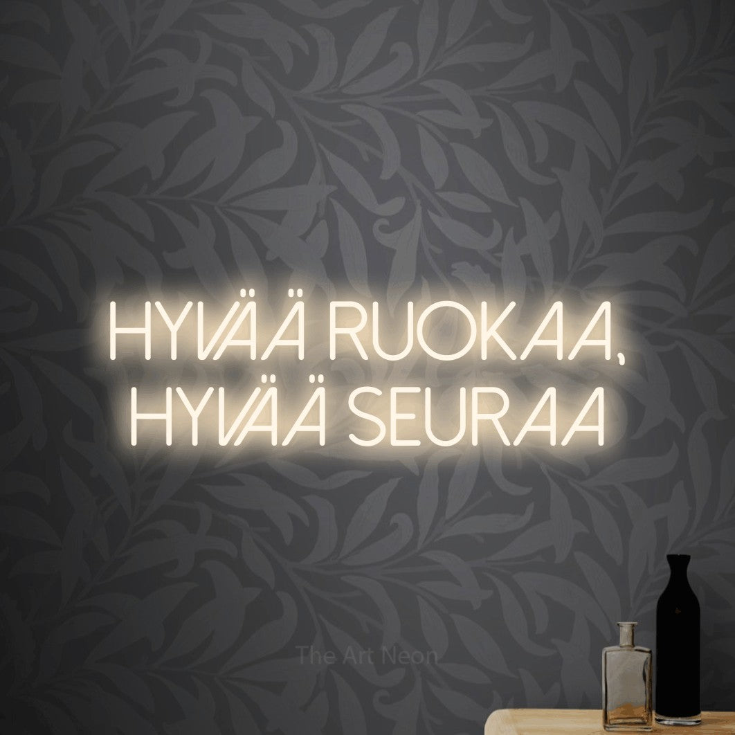 LED neon sign reading “Hyvää ruokaa, hyvää seuraa”, arranged in 2 lines.