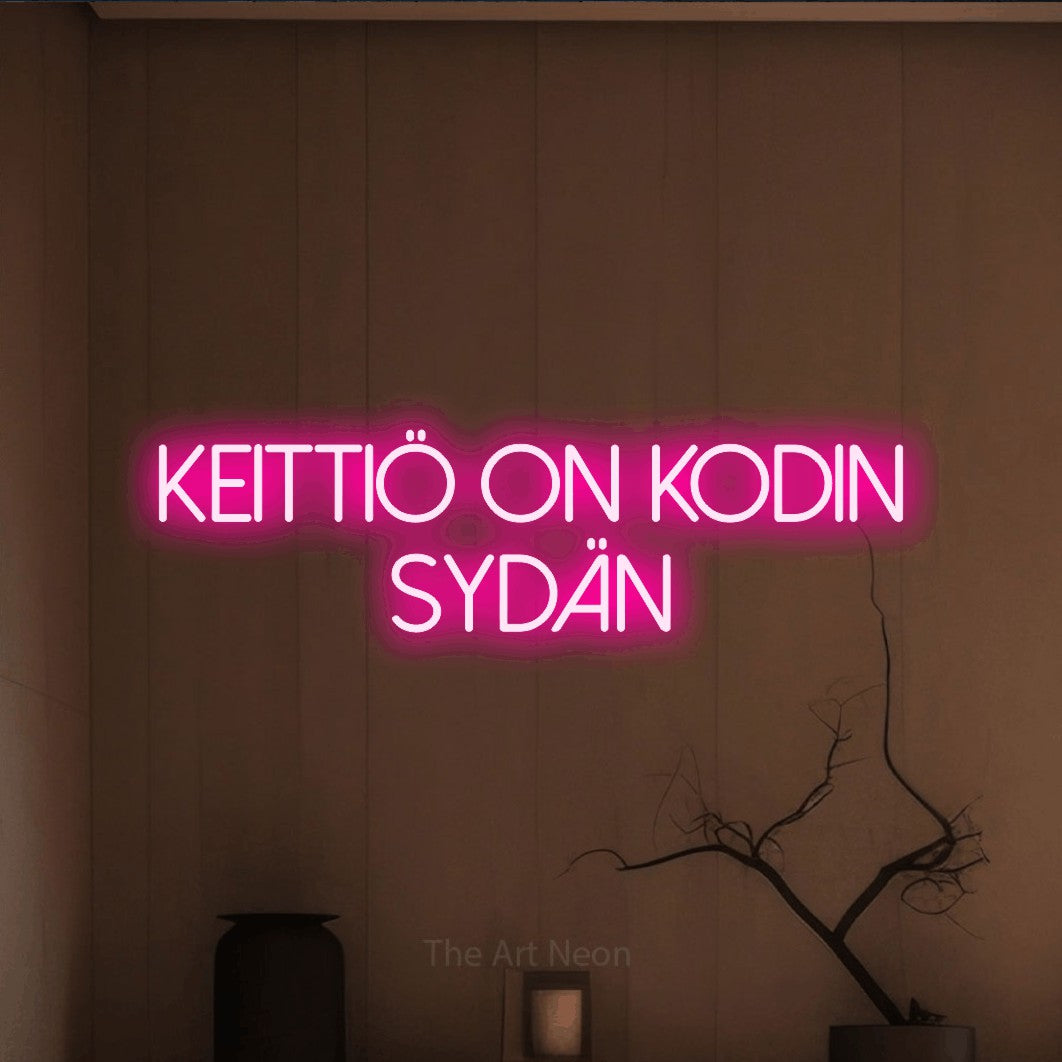 LED neon sign reading “keittiö on kodin sydän”, arranged in 2 lines.