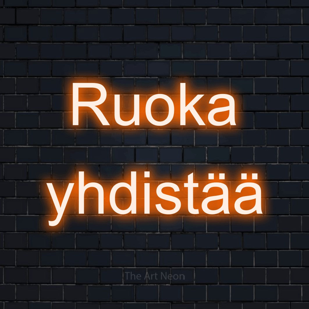 LED neon sign reading “Ruoka yhdistää”, arranged in 2 lines.