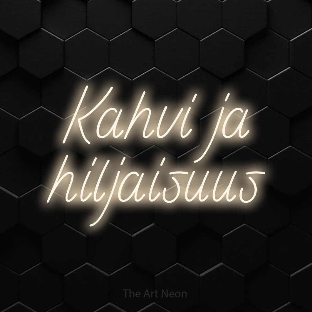 LED neon sign reading “Kahvi ja hiljaisuus”, arranged in 2 lines.