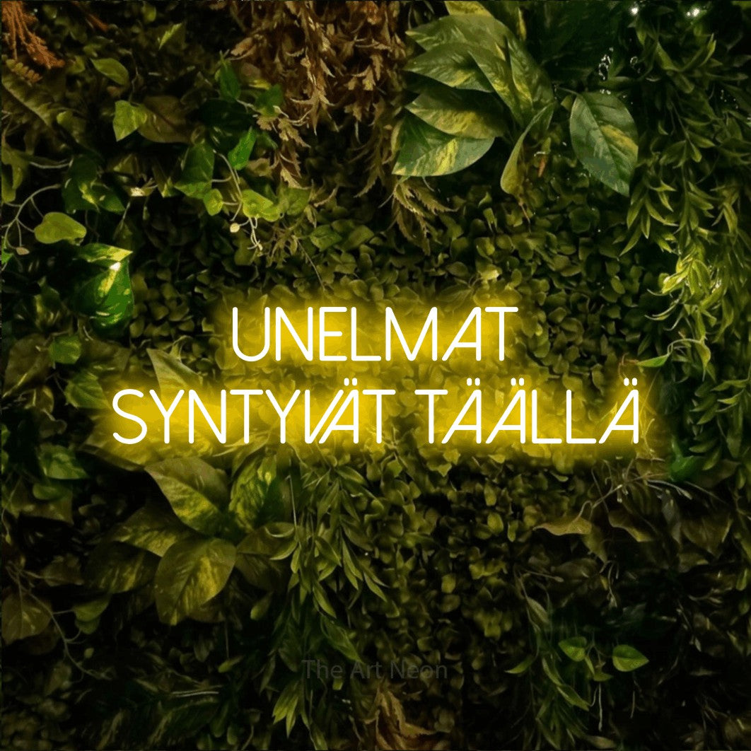 LED neon sign reading “unelmat syntyvät täällä”, arranged in 2 lines.