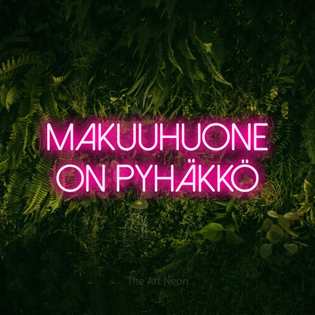 LED neon sign reading “MAKUUHUONE on pyhäkkö”, arranged in 2 lines.