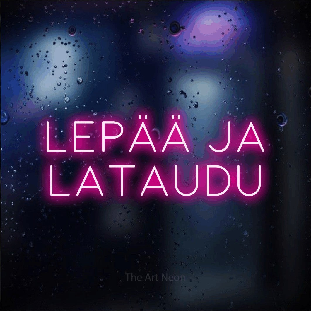 LED neon sign reading “Lepää ja lataudu”, arranged in 2 lines.