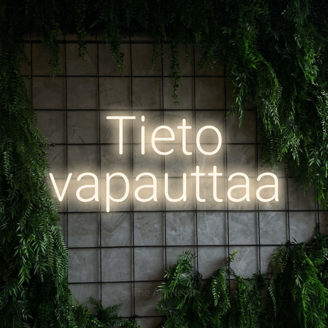 LED neon sign reading “Tieto vapauttaa”, arranged in 2 lines.