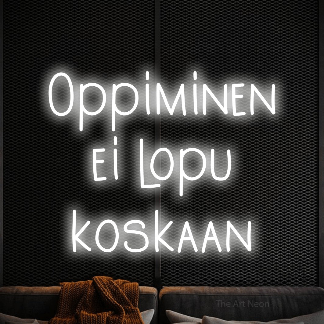 LED neon sign reading “Oppiminen ei lopu koskaan”, arranged in 3 lines.