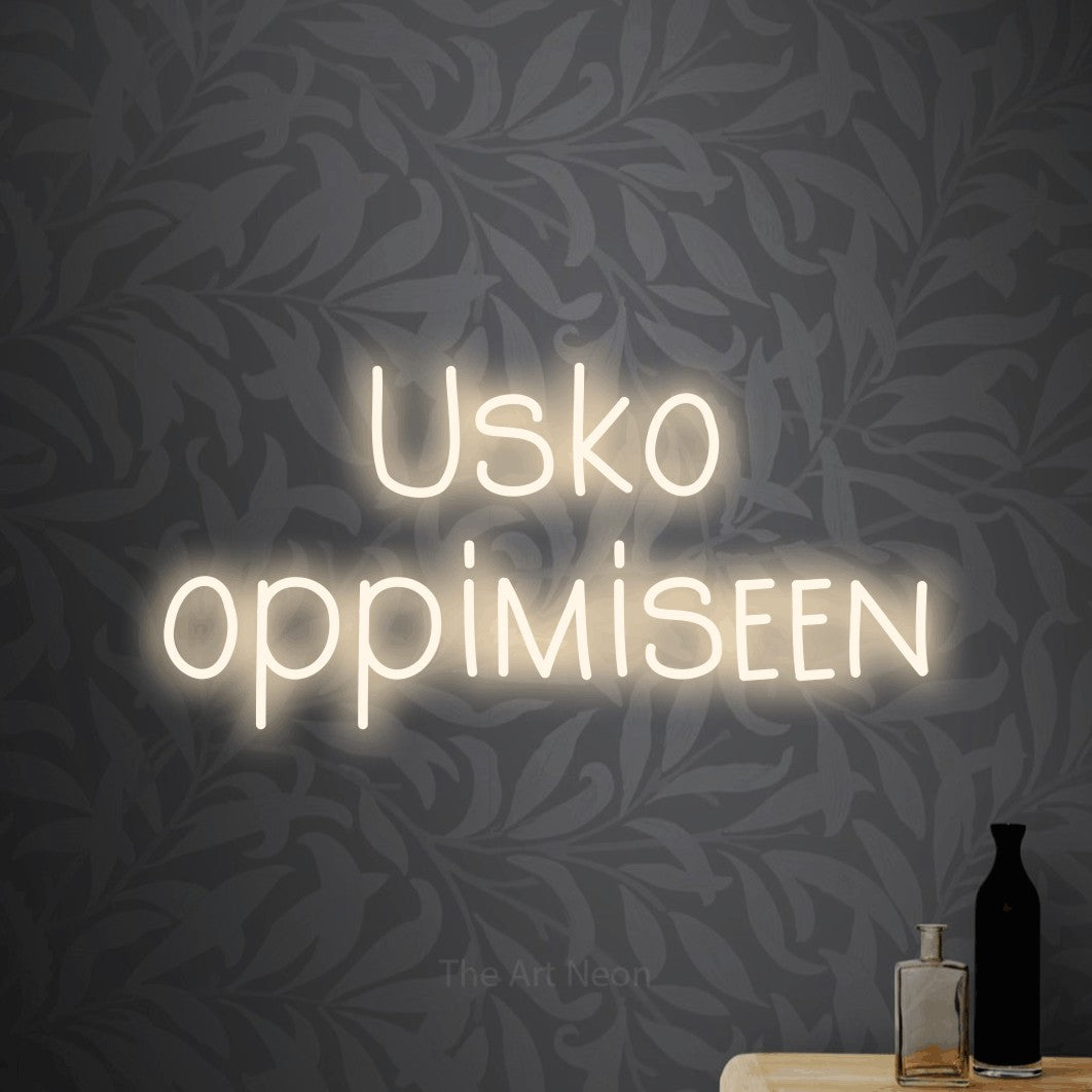 LED neon sign reading “Usko oppimiseen”, arranged in 2 lines.