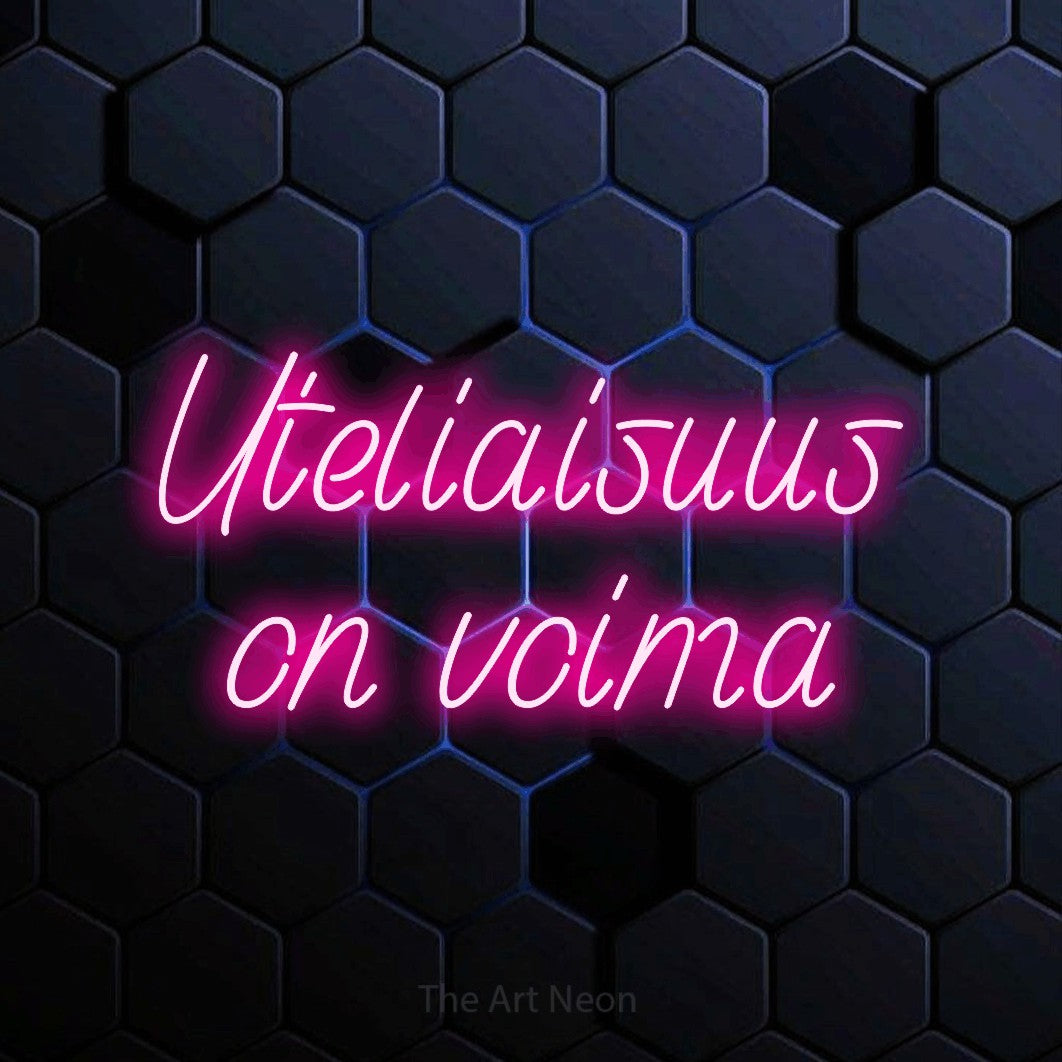 LED neon sign reading “Uteliaisuus on voima”, arranged in 2 lines.