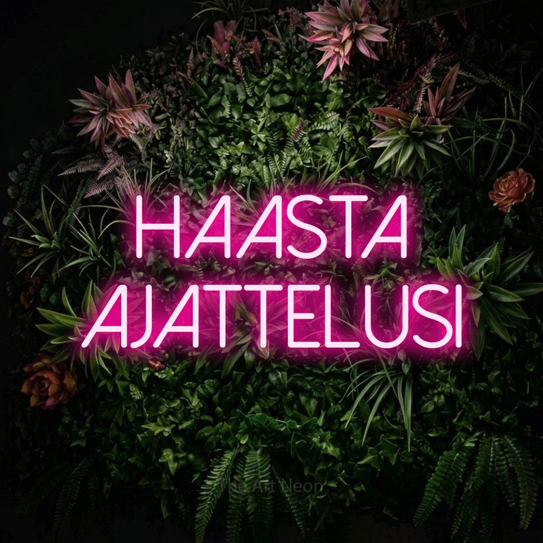 LED neon sign reading “Haasta ajattelusi”, arranged in 2 lines.