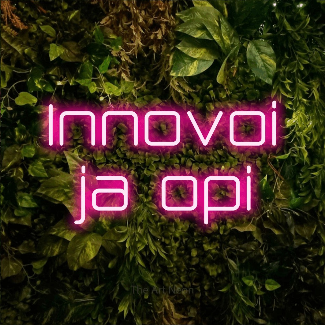 LED neon sign reading “Innovoi ja opi”, arranged in 2 lines.