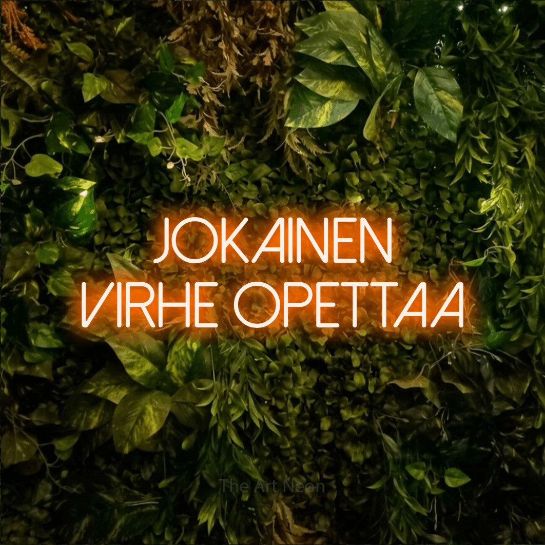 LED neon sign reading “Jokainen virhe opettaa”, arranged in 2 lines.