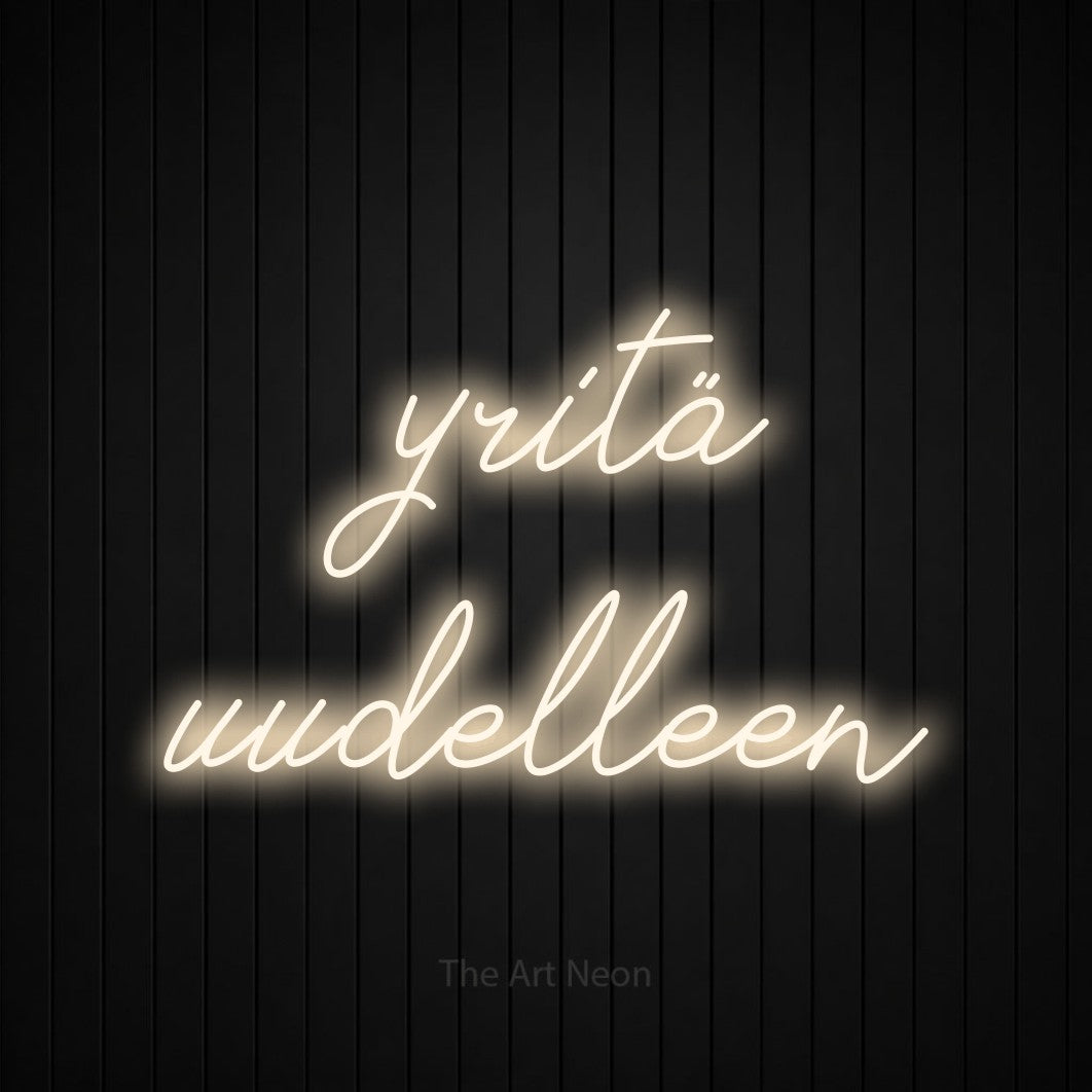 LED neon sign reading “yritä uudelleen”, arranged in 2 lines.