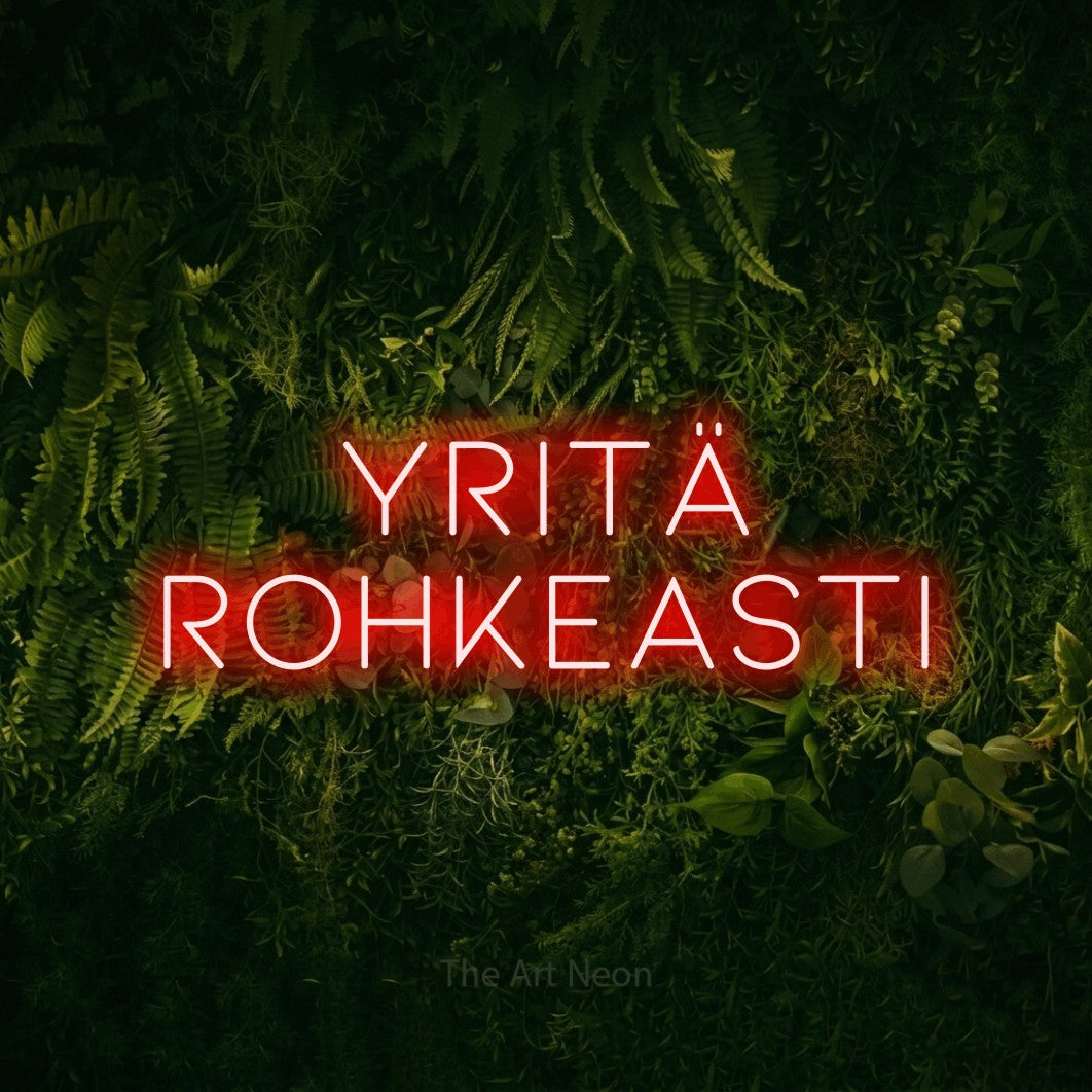 LED neon sign reading “Yritä rohkeasti”, arranged in 2 lines.