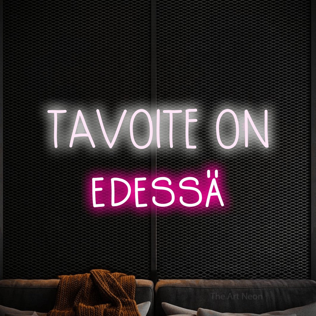 LED neon sign reading “TAVOITE ON edessä”, arranged in 2 lines.
